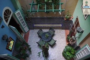 Cuba, the inner patio of a casa particular in Havana